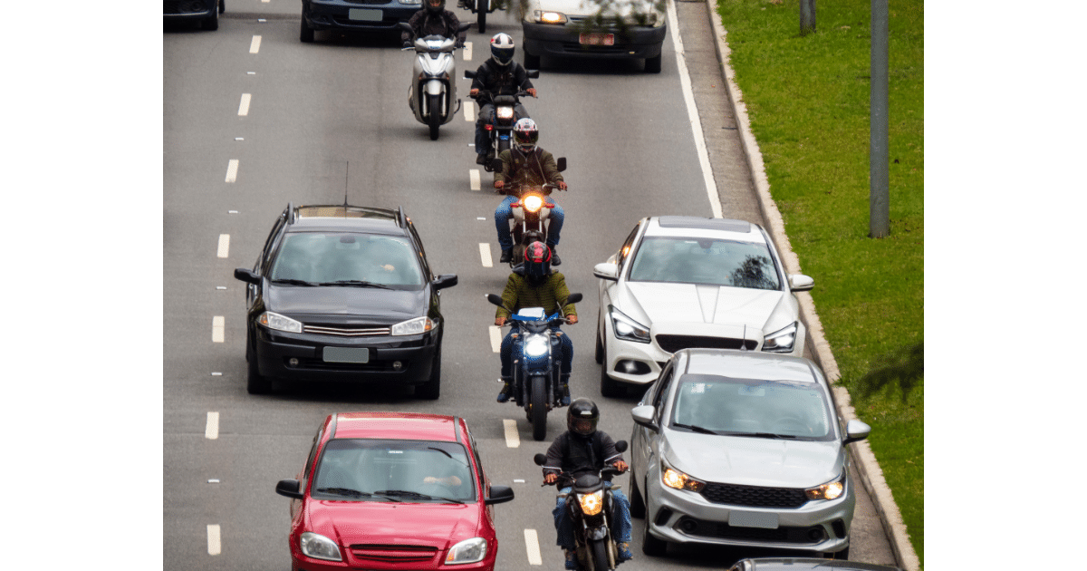 a line of motorcyclist splitting the lane on a Virginia highway.