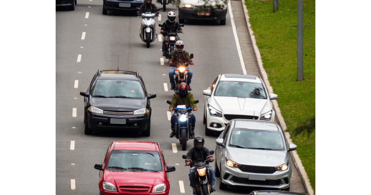 a line of motorcyclist splitting the lane on a Virginia highway.